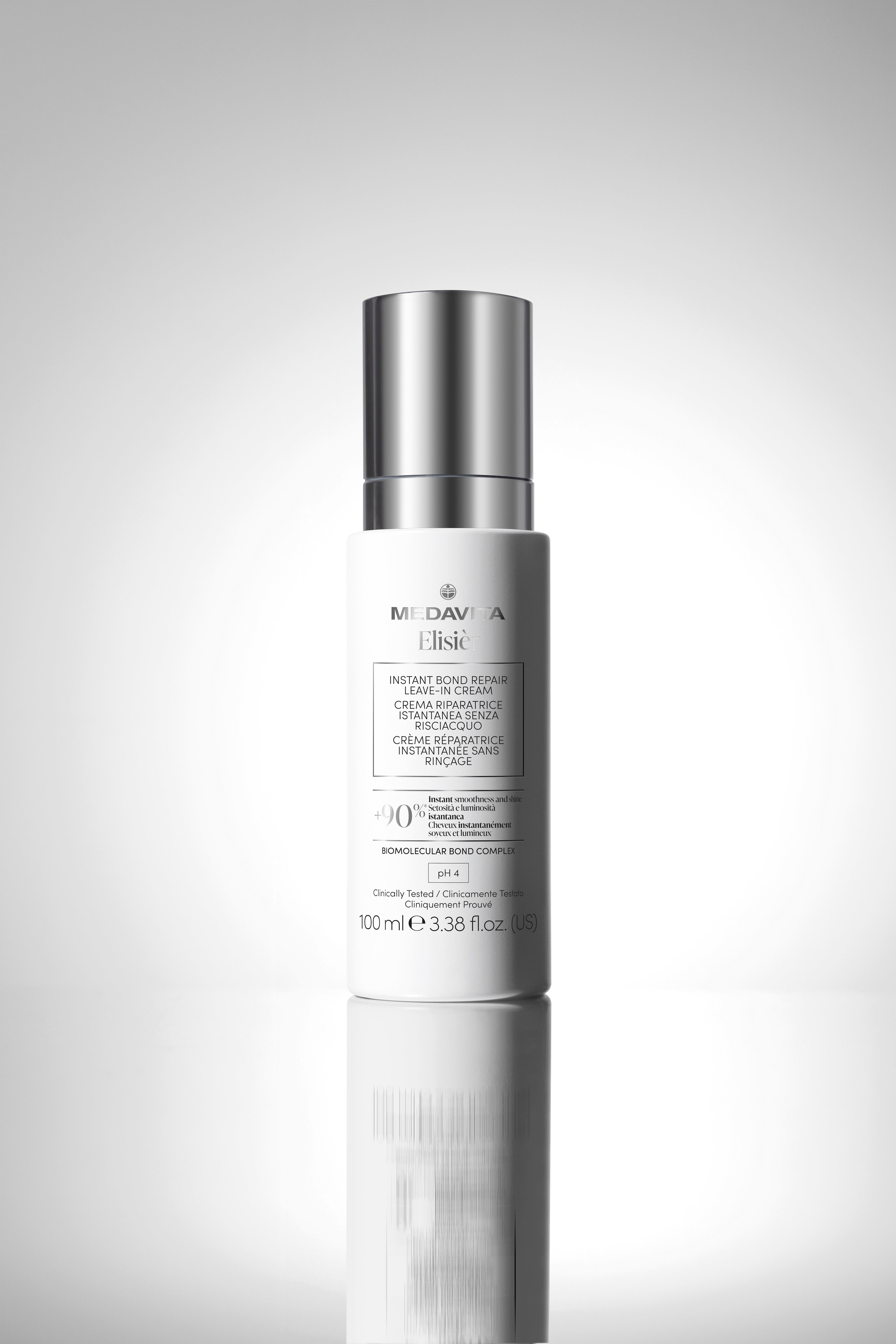 Medavita Elisièr Instant Bond Repair Leave-In Cream 100 ml, cremă profesională fără clătire pentru repararea părului deteriorat, efect anti-frizz și protecție termică până la 230°C.