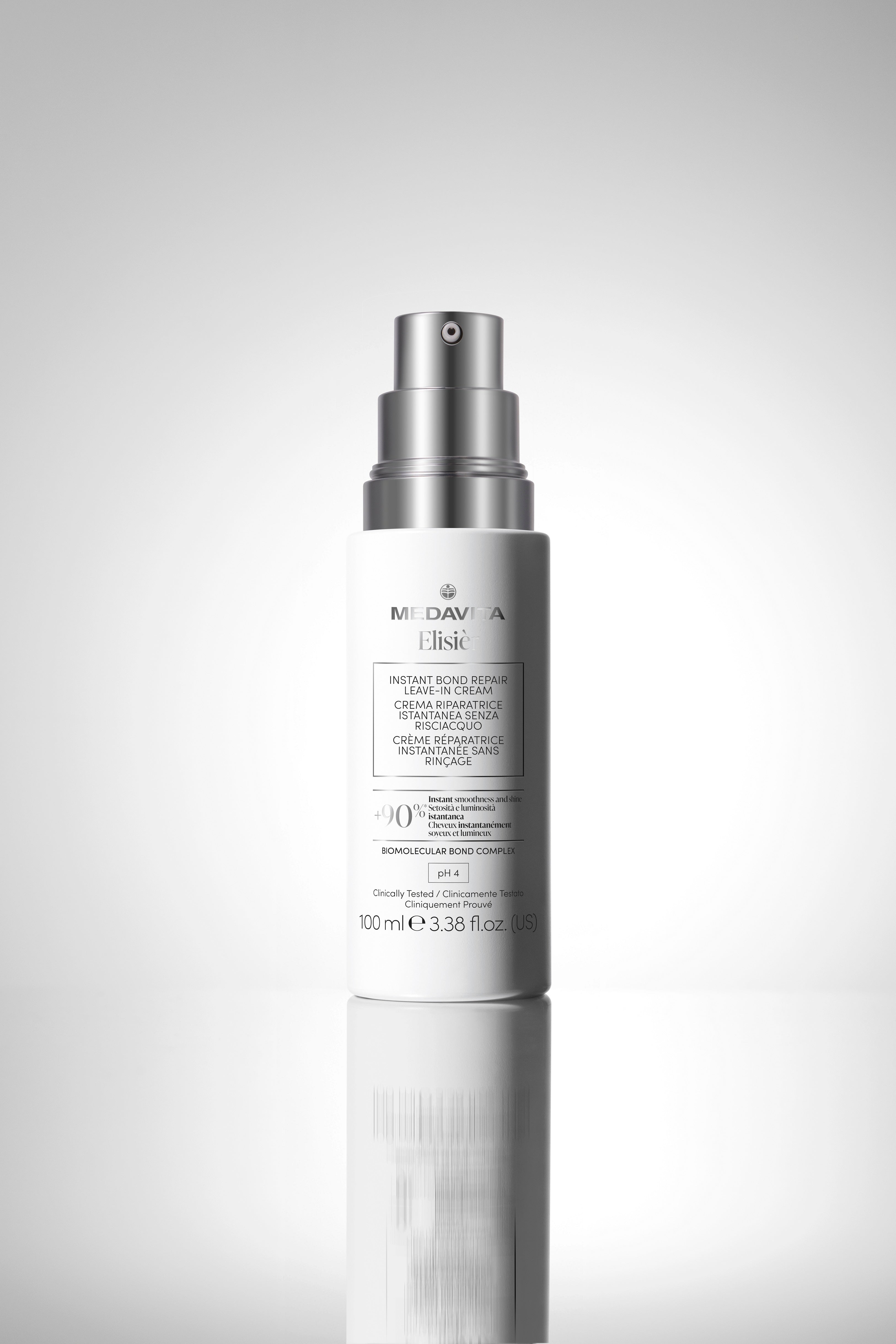 Medavita Elisièr Instant Bond Repair Leave-In Cream cu pompă de dozare, cremă leave-in profesională pentru repararea părului deteriorat și protecție termică până la 230°C.