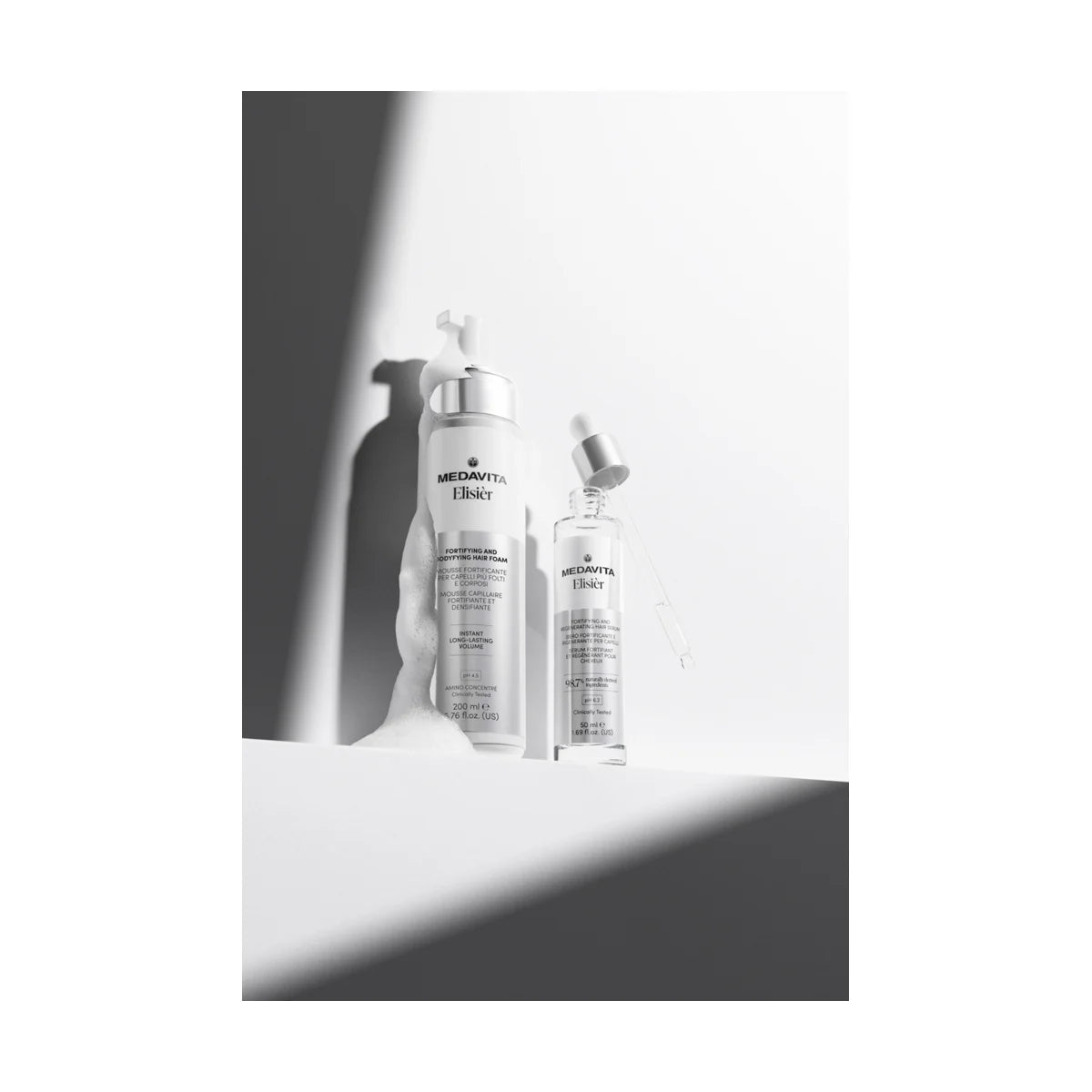 Kit profesional Medavita Elisier cu ser fortifiant și spumă pentru volum, prezentare premium a gamei Strength & Body Edition.